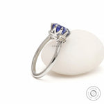 Platinum three stone engagement ring with oval sapphire