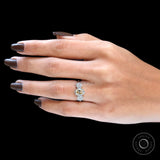 Oval champagne trilogy moissanite ring on hand view