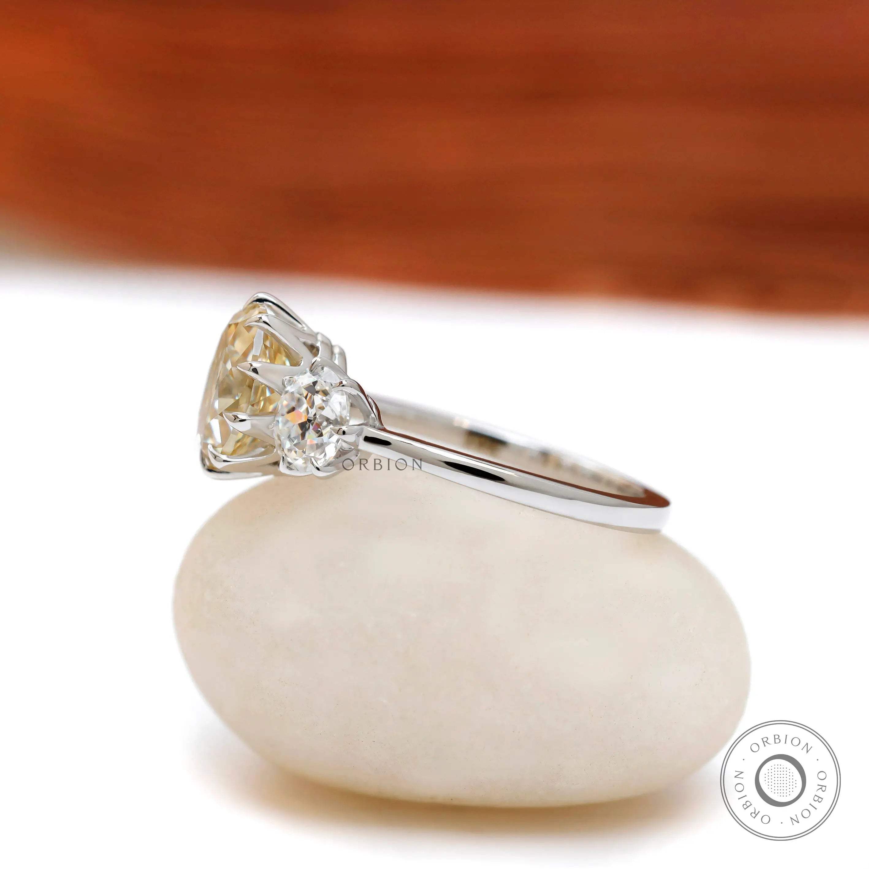 Old mine cut oval champagne trilogy moissanite ring side profile