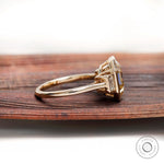 Emerald step cut moissanite ring side profile bezel setting