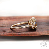 Emerald step cut moissanite ring side profile bezel setting