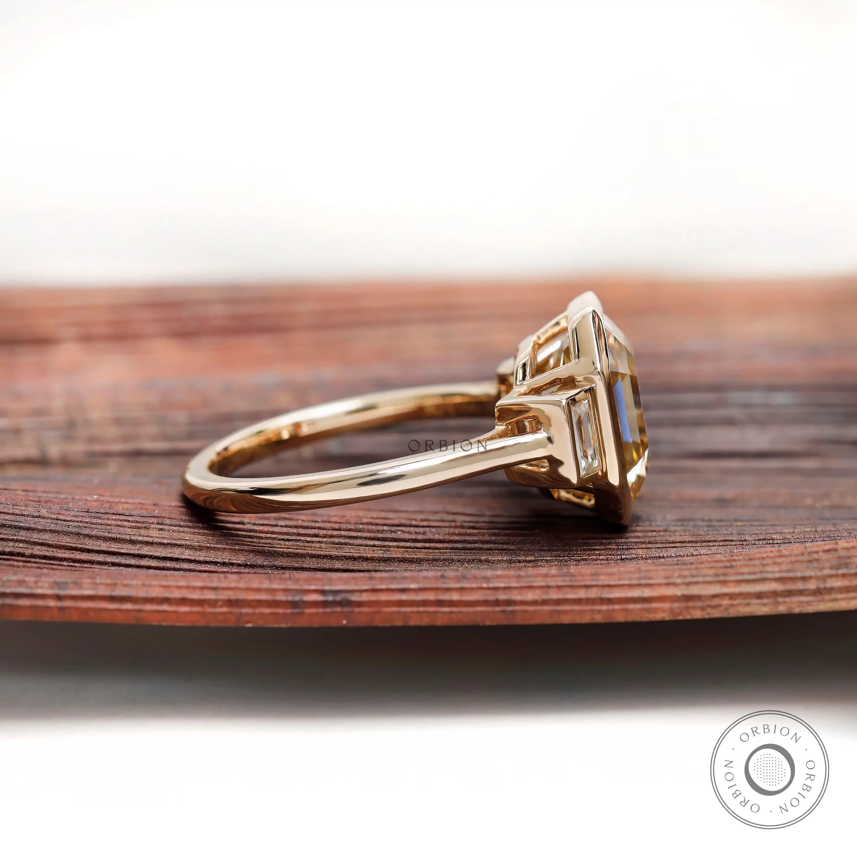 Emerald step cut moissanite ring side profile bezel setting