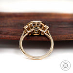 Bezel set emerald and baguette moissanite ring gallery view
