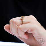 Art Deco inspired emerald cut moissanite bezel ring