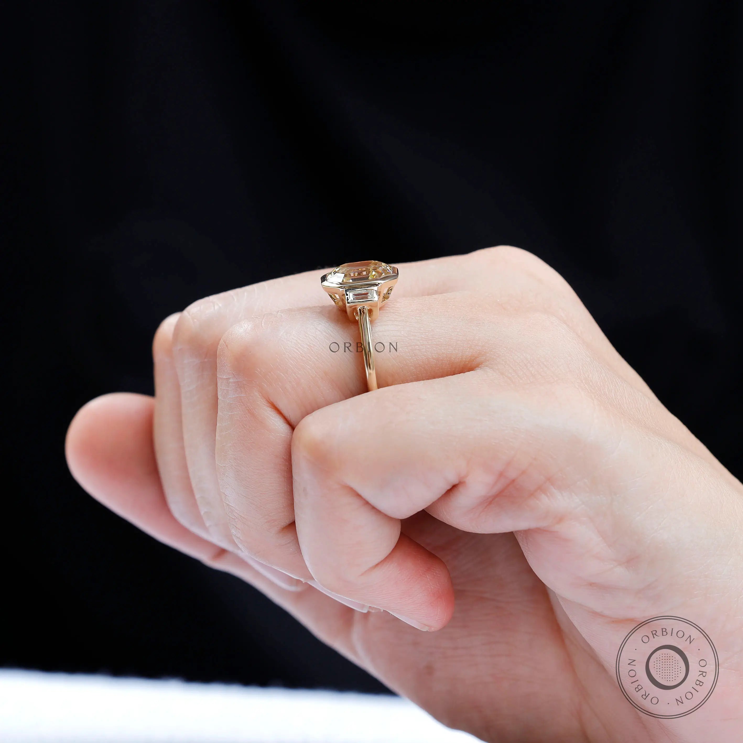 Art Deco inspired emerald cut moissanite bezel ring