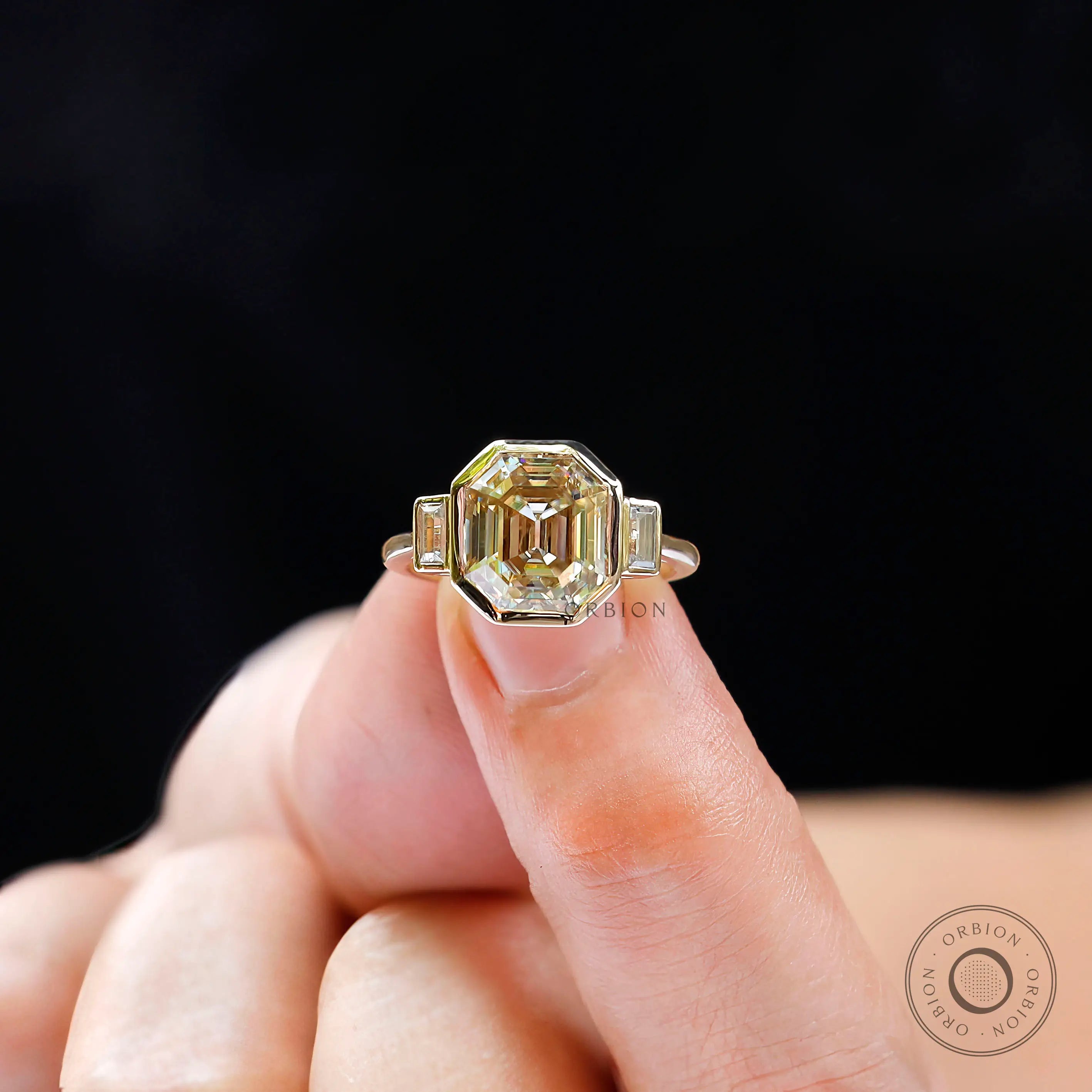 Geometric bezel emerald moissanite engagement ring
