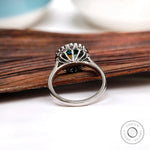 Back view of halo setting with oval moissanite in 10K white gold