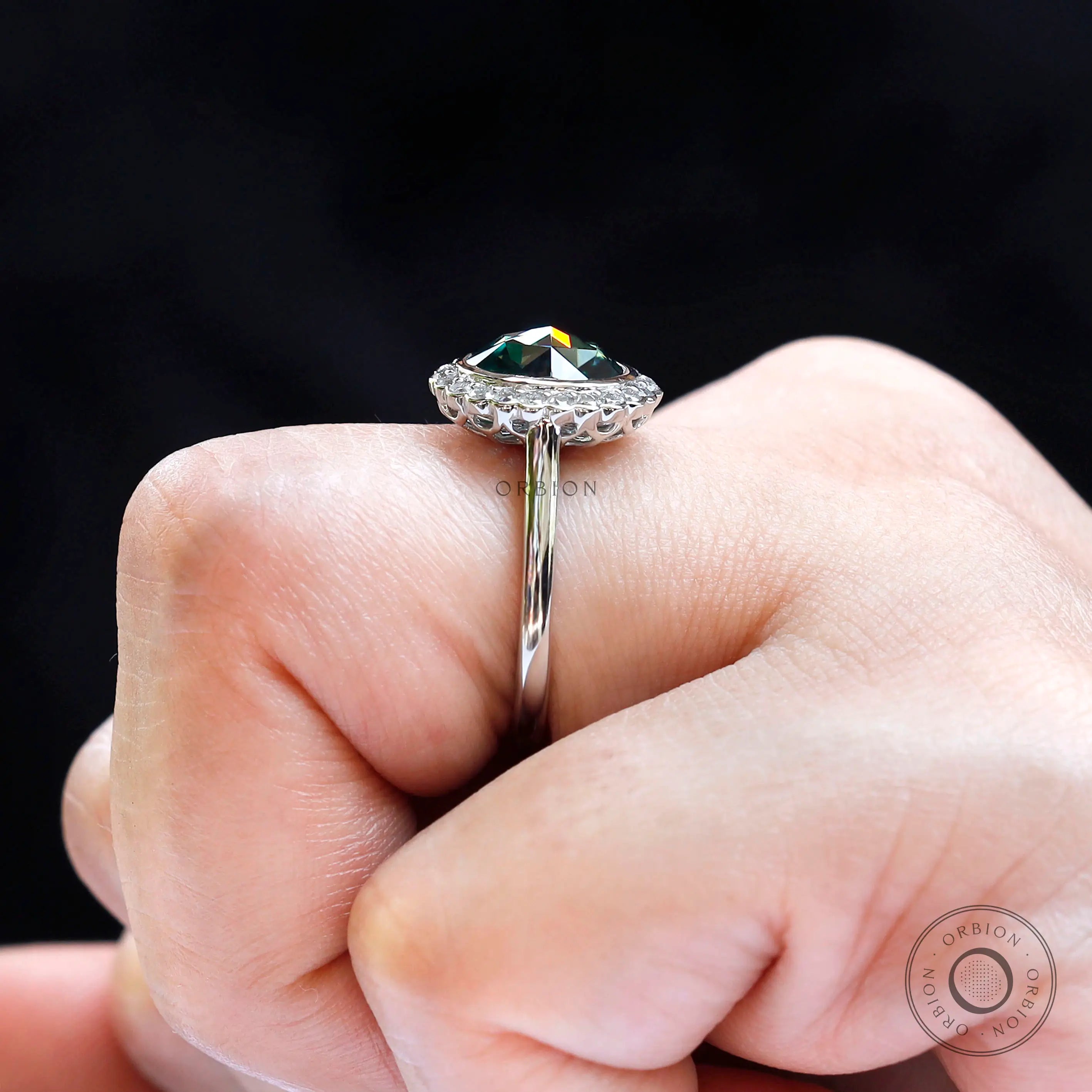 Close side profile highlighting rose cut depth and halo diamonds