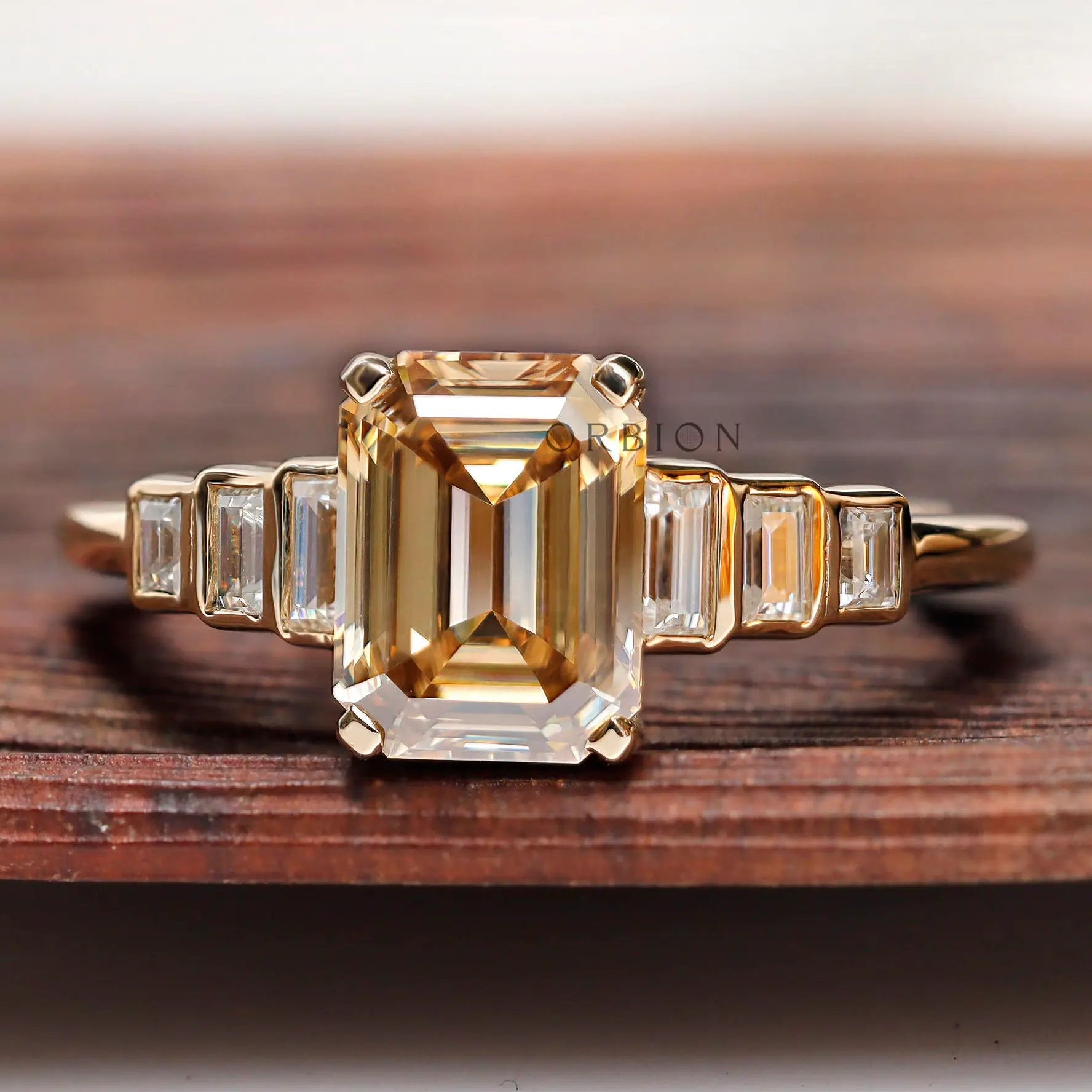 Emerald cut light champagne moissanite 3 stone engagement ring