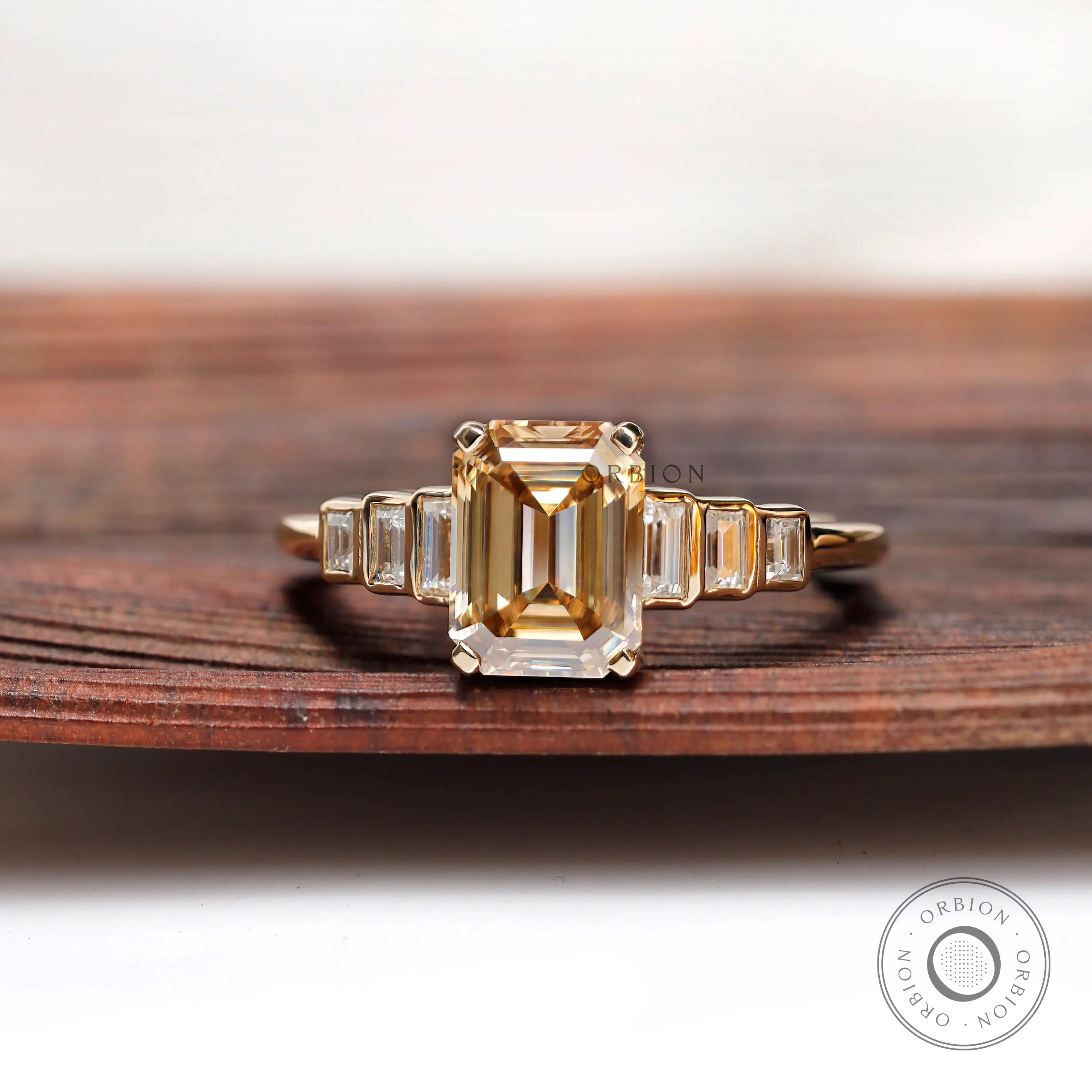 Emerald cut light champagne moissanite 3 stone engagement ring