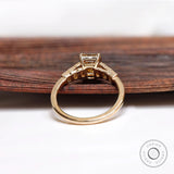 Gallery view of champagne moissanite emerald cut engagement ring in yellow gold