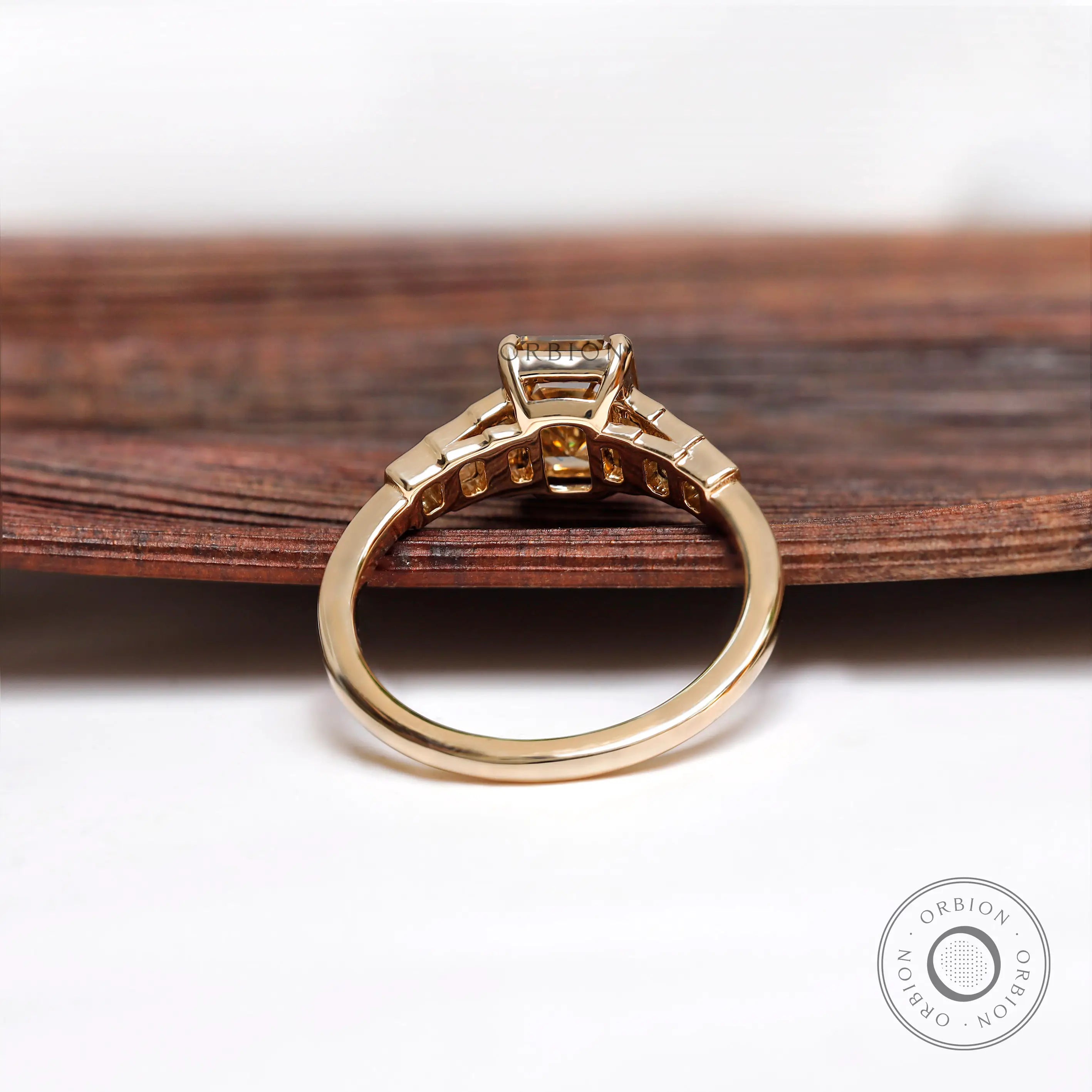 Gallery view of champagne moissanite emerald cut engagement ring in yellow gold