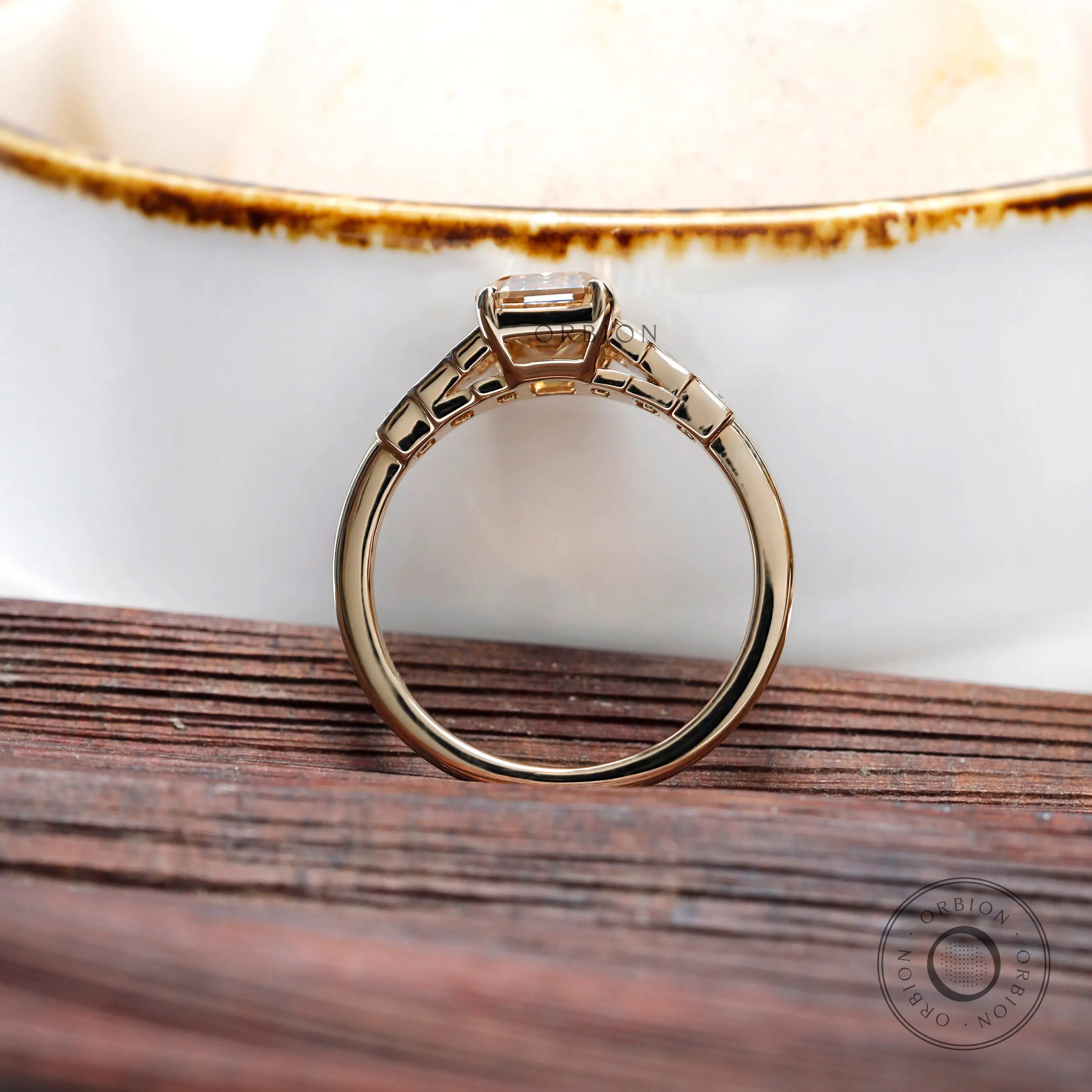 Minimalist emerald cut champagne moissanite ring with step cut baguette accents