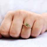 Elegant champagne moissanite 3 stone engagement ring worn on hand