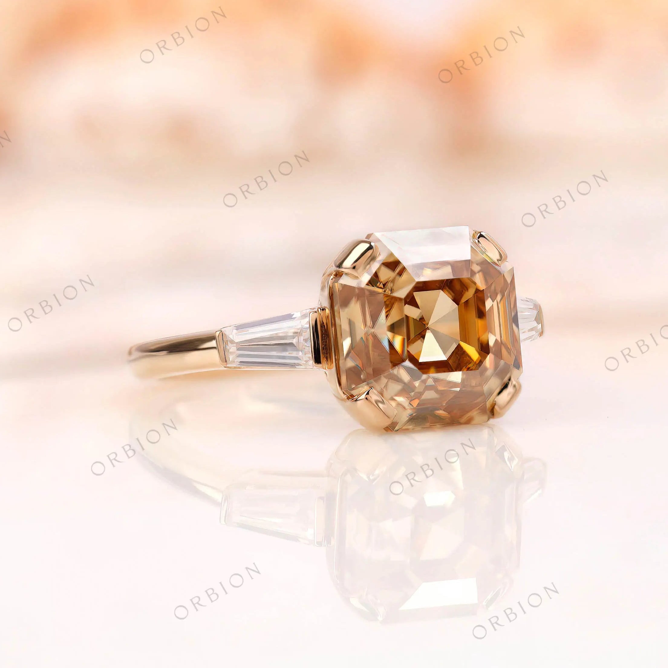 Angled view of Asscher moissanite ring with baguette side stones