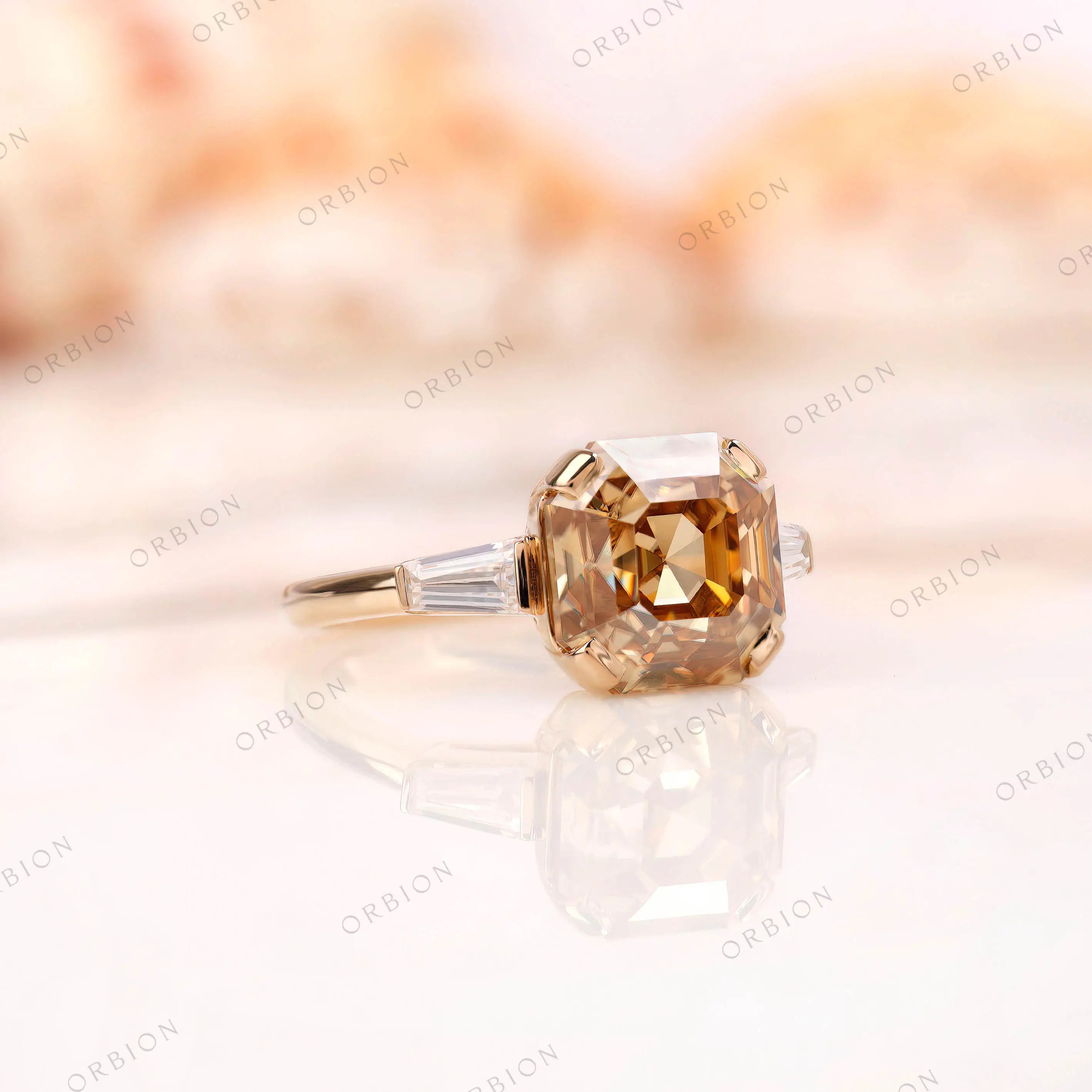 Angled view of Asscher moissanite ring with baguette side stones