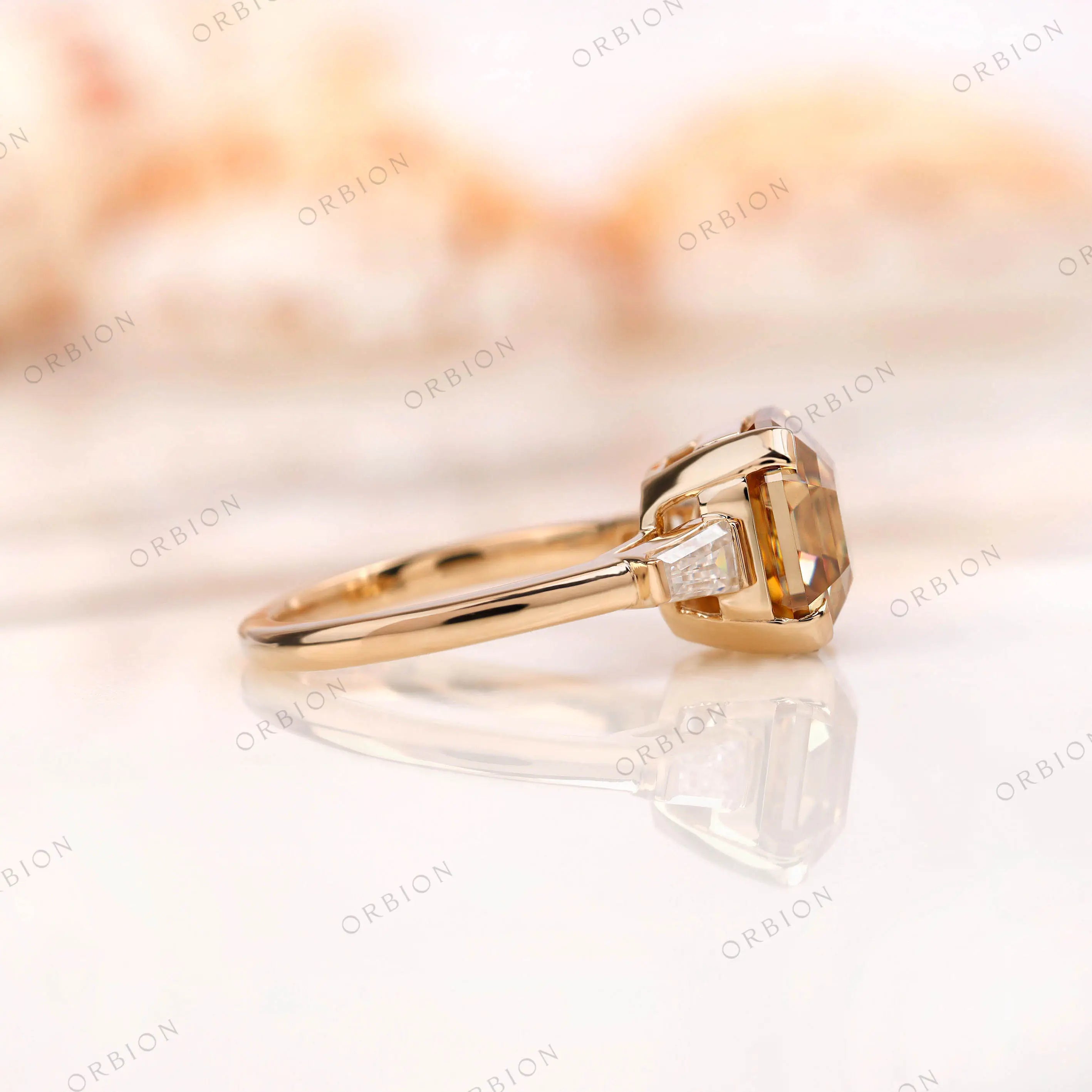 Side profile showing step cut center stone and setting