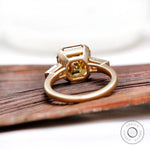 Under gallery of octagon champagne moissanite three stone ring