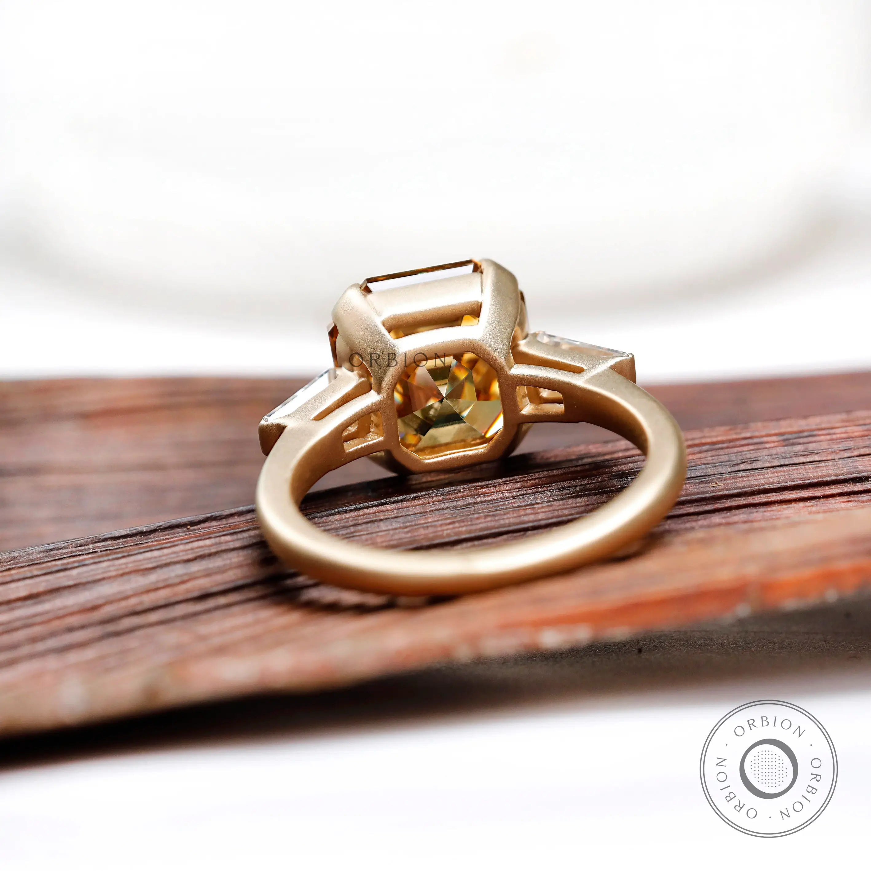 Under gallery of octagon champagne moissanite three stone ring