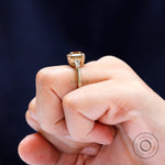 Baguette side stone detailing on three stone engagement ring