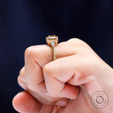 Baguette side stone detailing on three stone engagement ring