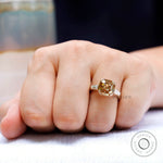 Architectural three stone moissanite ring in yellow gold