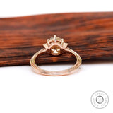 Back view of Champagne OEC Moissanite ring in rose gold with baguette accents.
