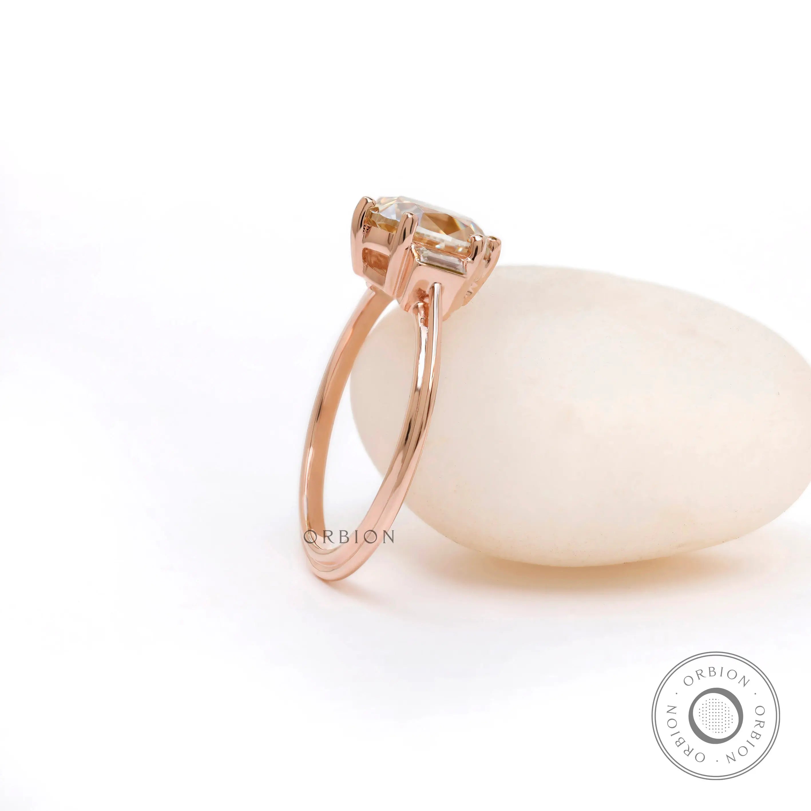 Top view of OEC Champagne Moissanite ring with baguette accents