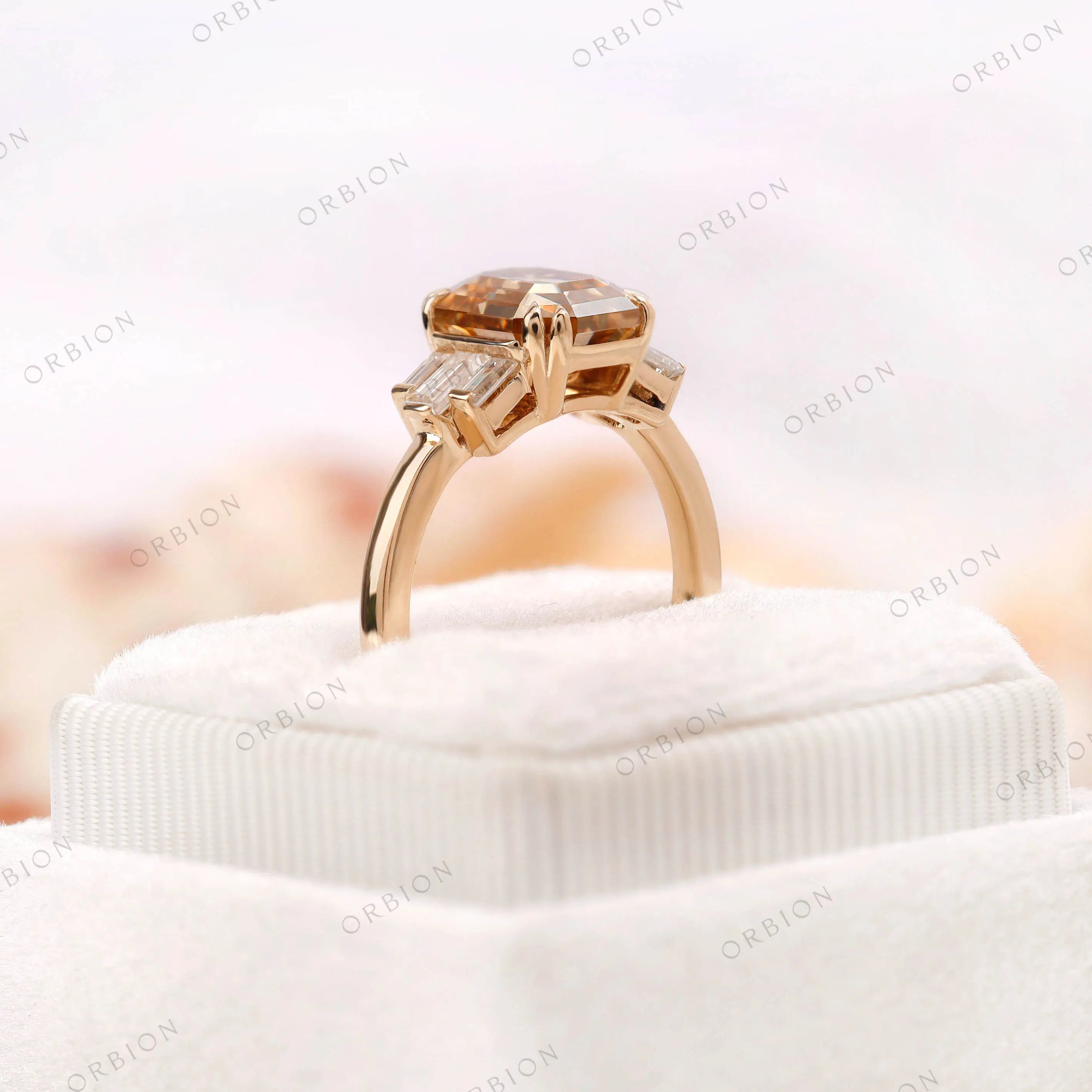 Champagne moissanite engagement ring displayed in a ring box