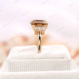 Side Profile view of cluster engagement ring on box