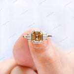 Close-up shot of champagne moissanite ring held on hand