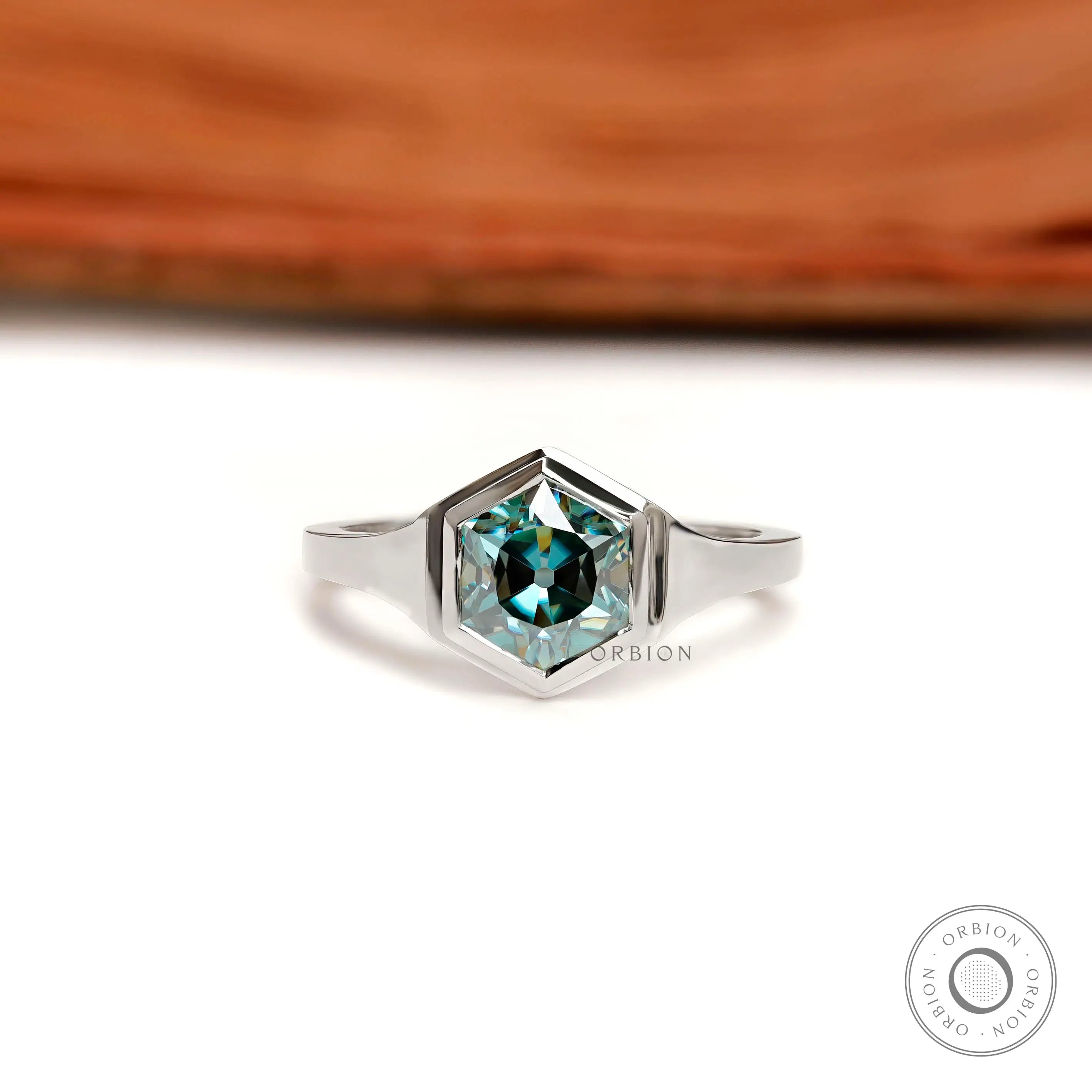 Front view of hexagon blue-green moissanite solitaire ring