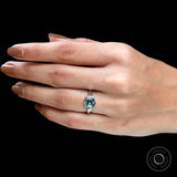 Side view of hexagon moissanite ring on stone prop
