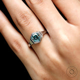 Close-up view of blue-green hexagon moissanite
