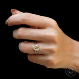 Vintage inspired pear moissanite split shank engagement ring with old mine cut brilliance