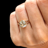 Close view of pear champagne moissanite split shank engagement ring with antique faceting