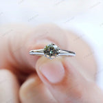 White gold solitaire ring with grey moissanite close up