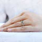 White gold solitaire ring with grey moissanite on fingure