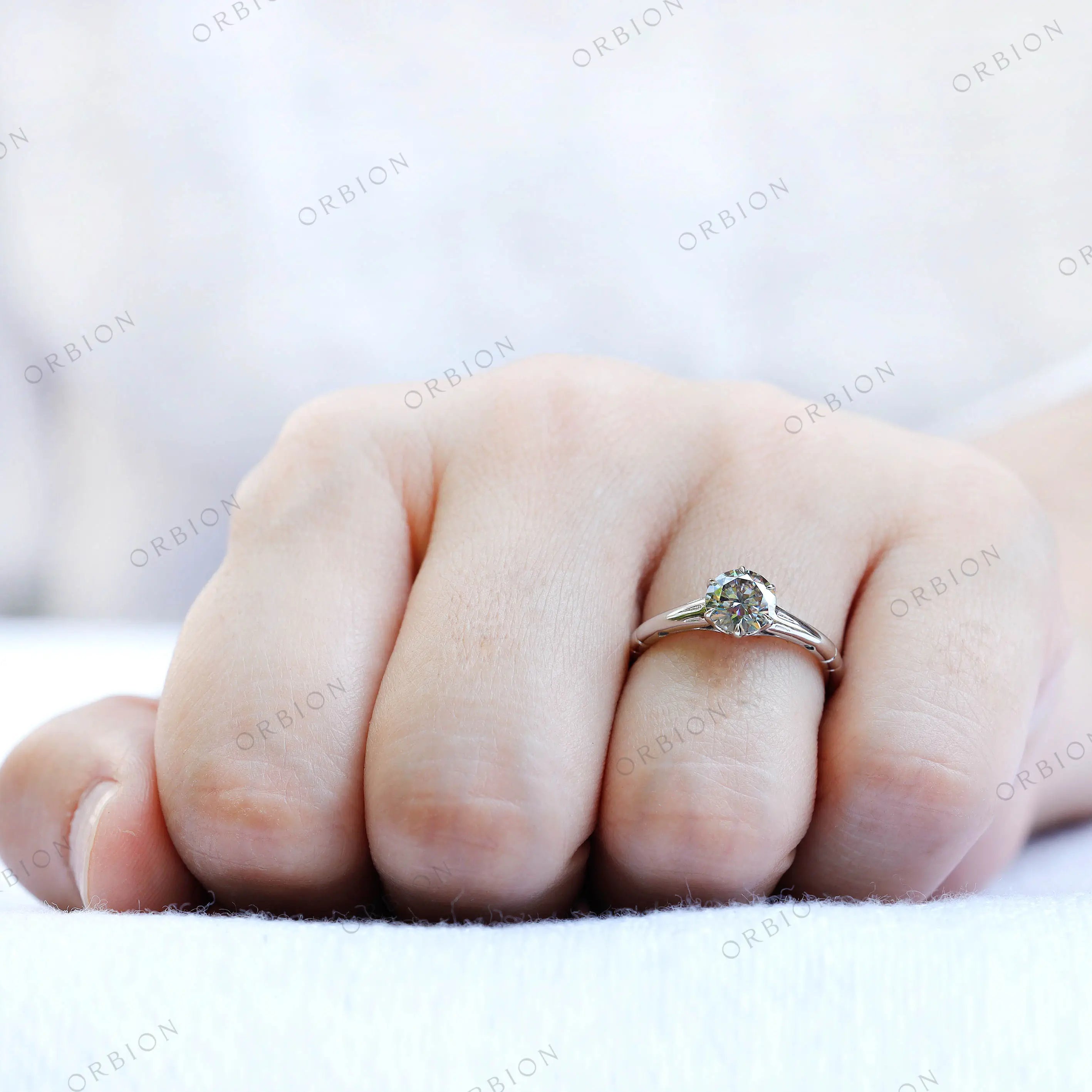 Grey moissanite solitaire ring prong setting detail