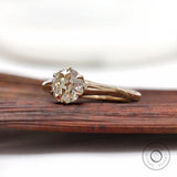 Vintage inspired round solitaire engagement ring side view