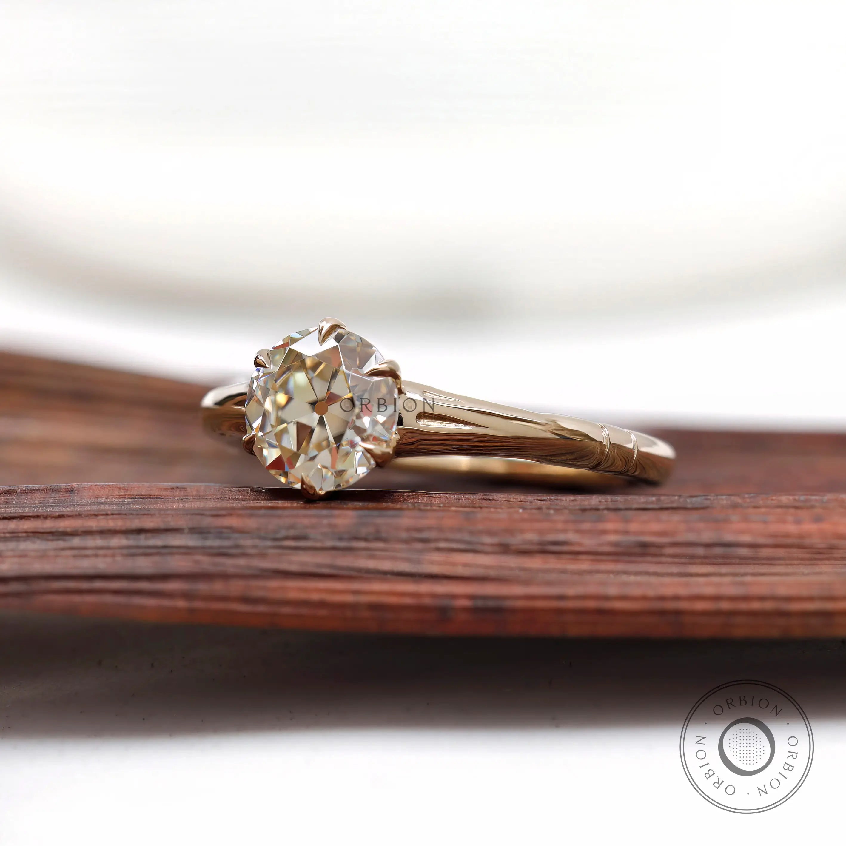 Vintage inspired round solitaire engagement ring side view