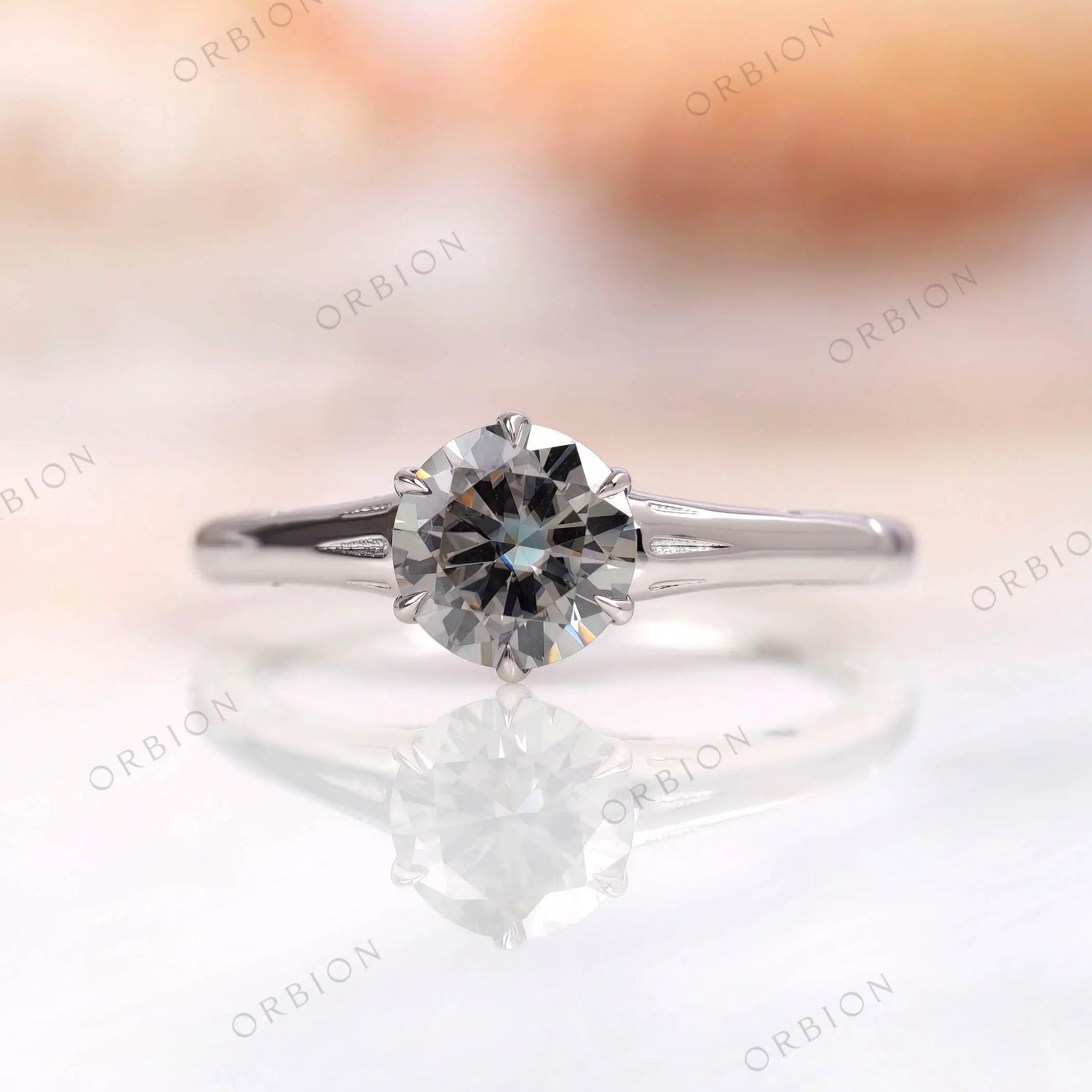 Classic solitaire ring with grey moissanite top view