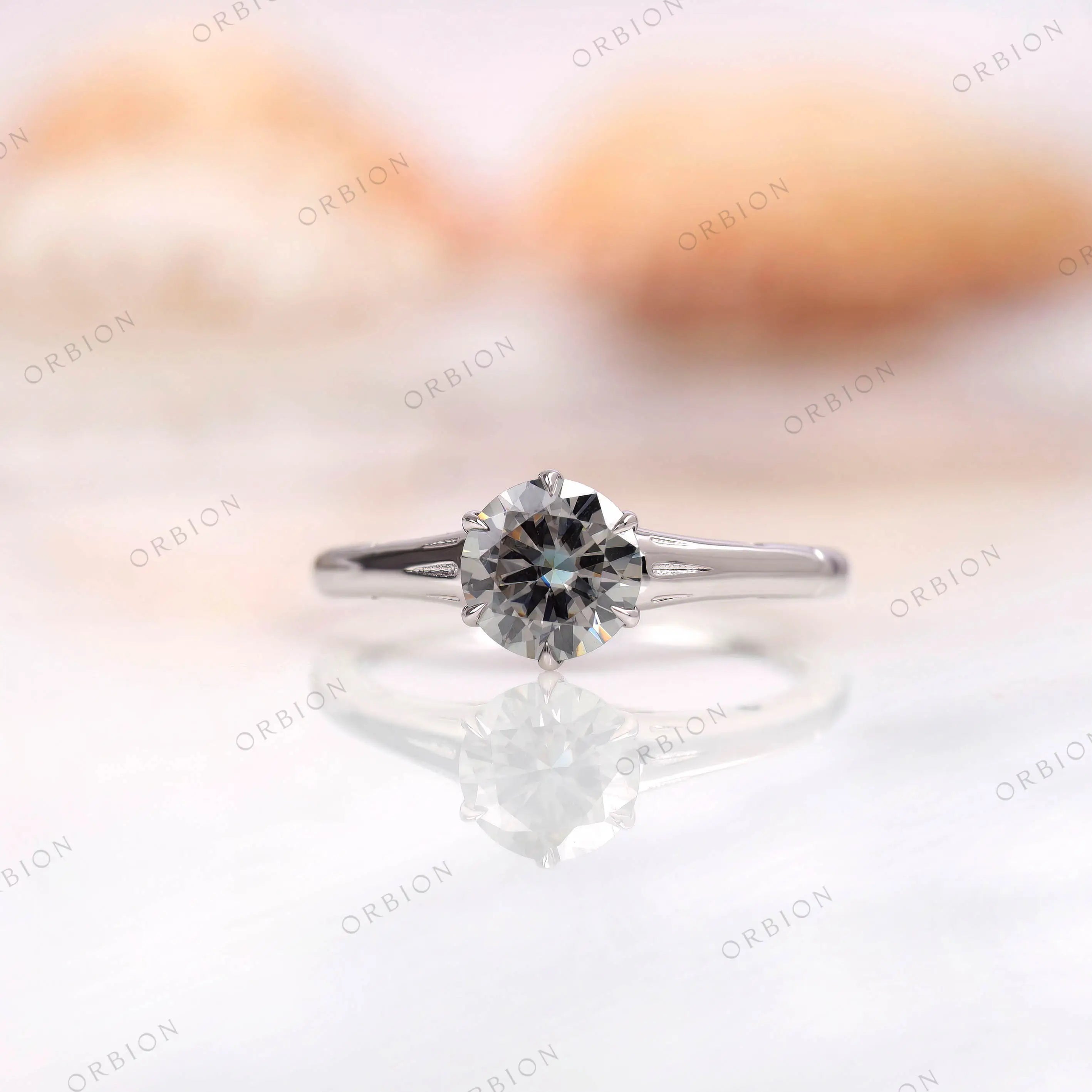 Classic solitaire ring with grey moissanite top view