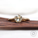 Round Old European cut moissanite solitaire ring in yellow gold top view