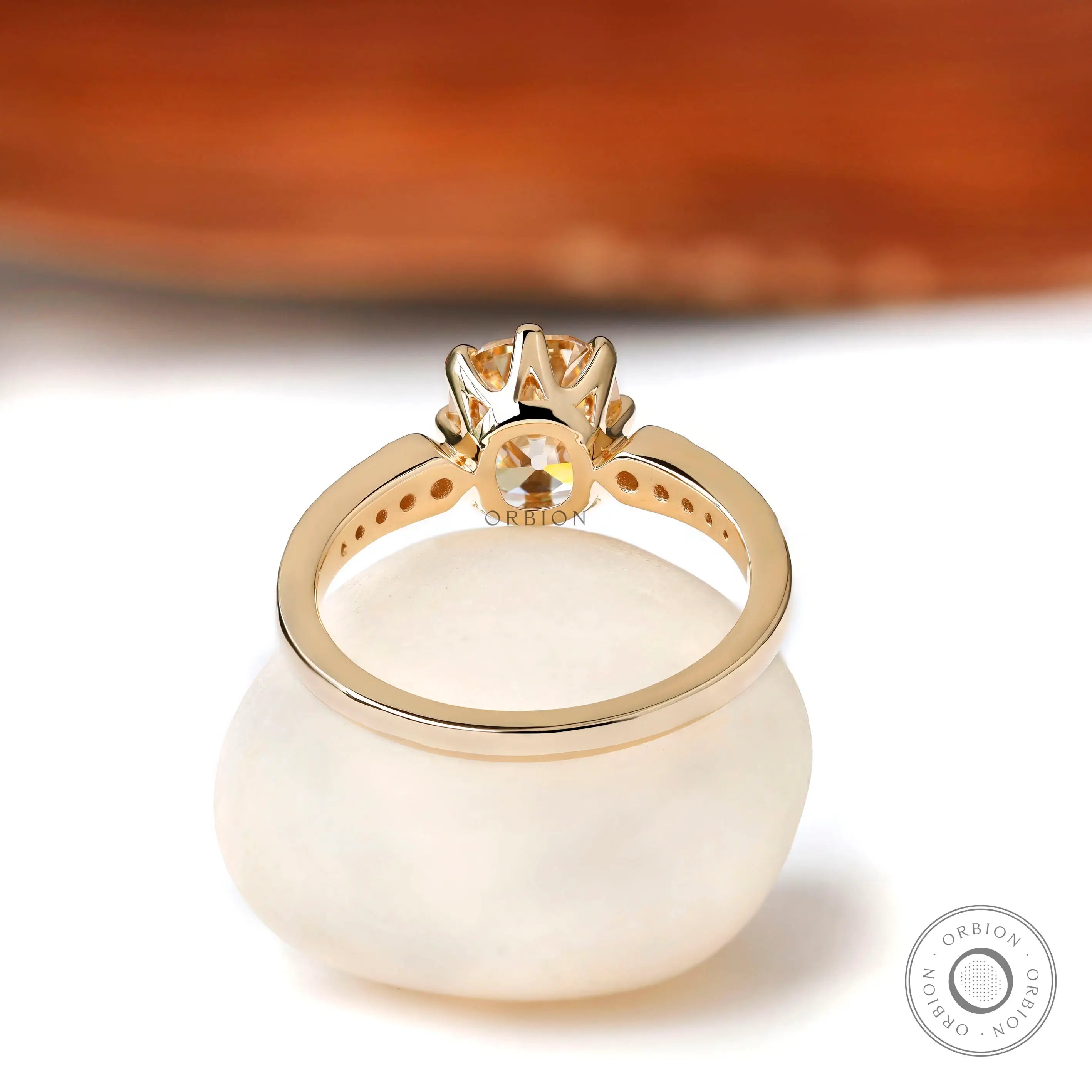 The back view of the Elongated Cushion Moissanite Engagement Ring with round brilliant side stones, showing the detailed gallery.