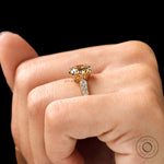 A close-up of the elongated cushion Moissanite engagement ring, highlighting the center stone and side Moissanite accents.