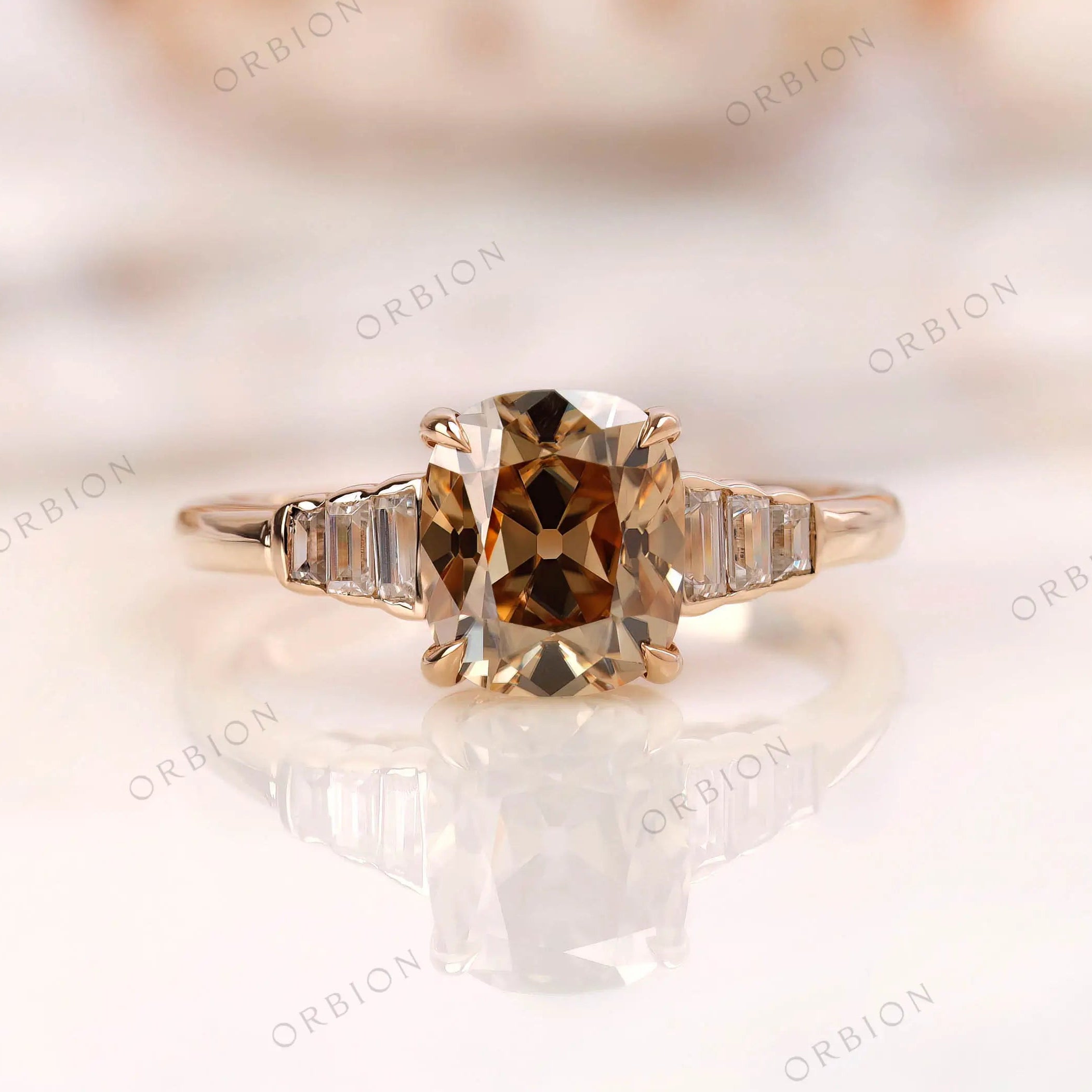 Dark champagne elongated cushion moissanite ring with baguette side stones front view