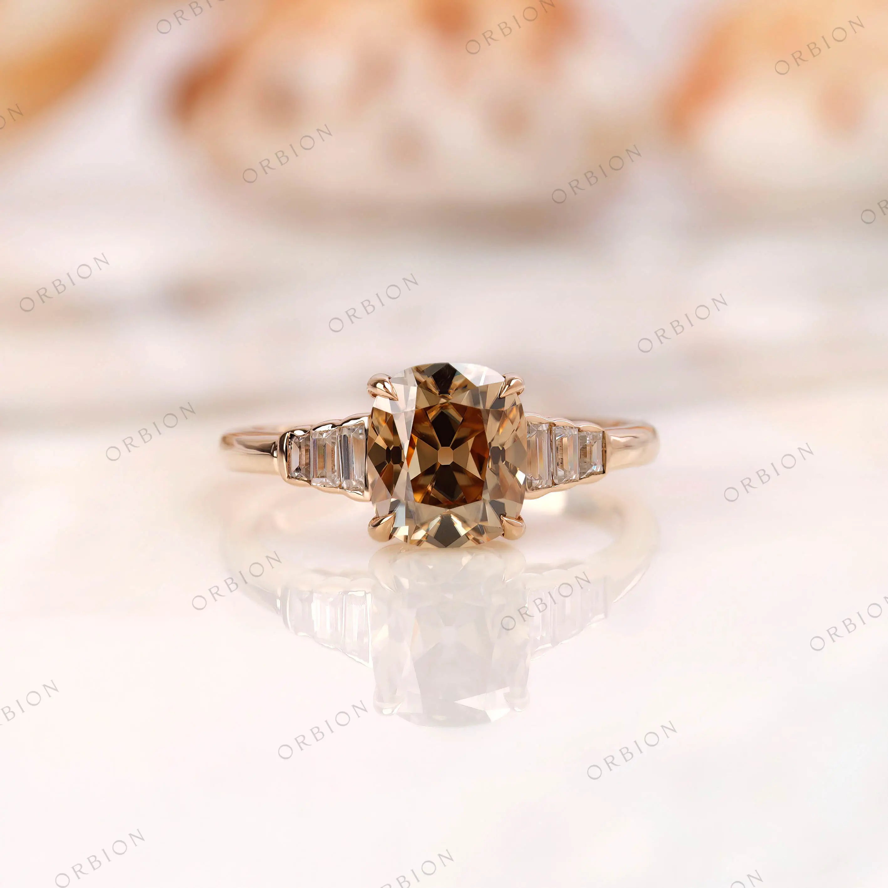 Dark champagne elongated cushion moissanite ring with baguette side stones front view