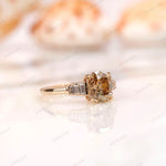 Close side detail of baguette step cut side stones on gold band
