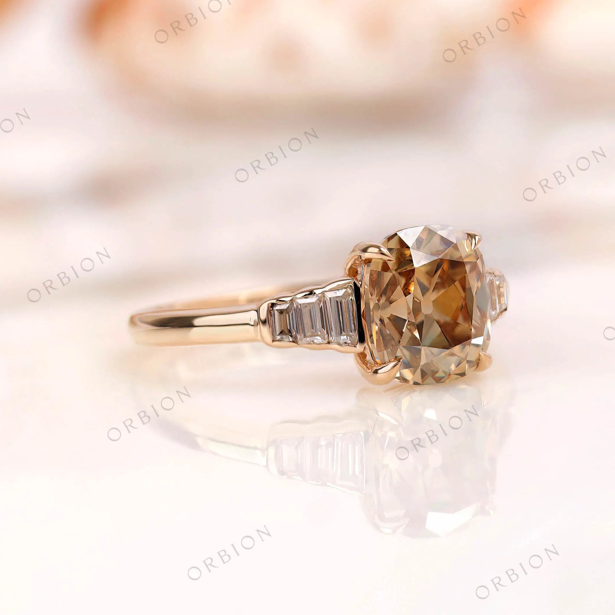 Close side detail of baguette step cut side stones on gold band